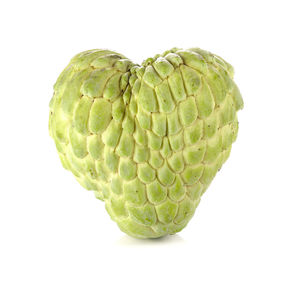 Close-up of fruit against white background