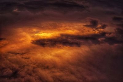 Low angle view of dramatic sky during sunset