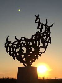 Low angle view of silhouette birds against sky during sunset