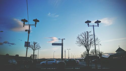 Low angle view of street light against sky at sunset