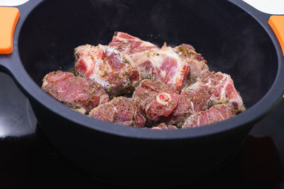 High angle view of meat in cooking pan