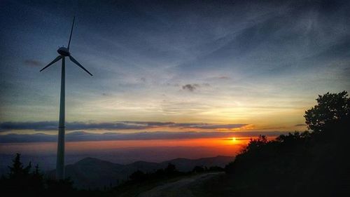 Scenic view of landscape against sky at sunset