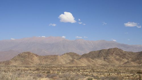 Scenic view of arid landscape against sky