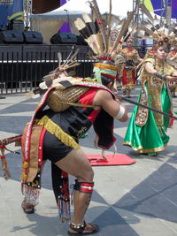 People dancing on street in city