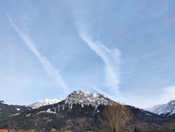 Low angle view of mountain range against sky