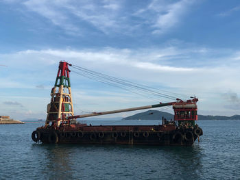 View of ship in sea against sky