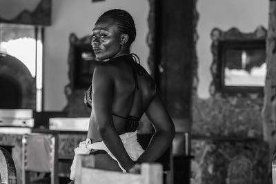 Ghana woman with happy look after a day at the beach in axim ghana west africa. 