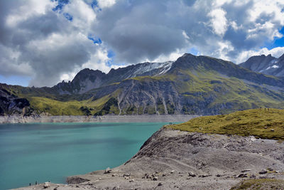 Scenic view of lake and mountains against sky