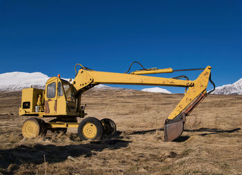 Construction site against clear blue sky