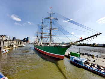 Boats in sea against sky