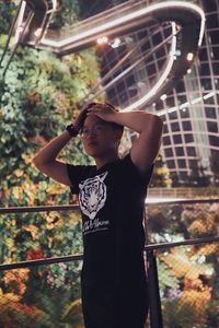 Portrait of young man standing in park