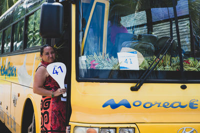 Portrait of woman sitting in car