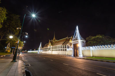 View of illuminated street at night