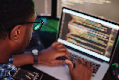 Close-up of computer programmer working at office