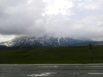 Scenic view of landscape and mountains against sky