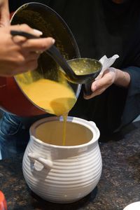 Midsection of man preparing food in kitchen