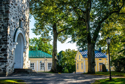 Trees and buildings against sky