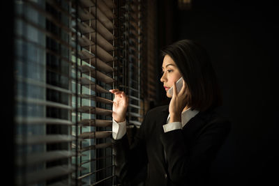 Portrait of young woman looking at camera