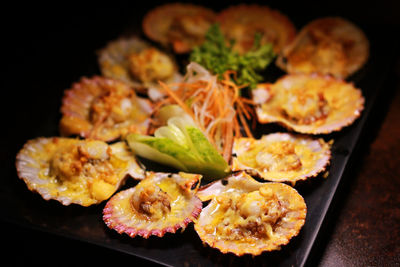 Close-up of food on table against black background