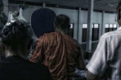 Rear view of people traveling in bus