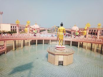 View of swimming pool in building against sky