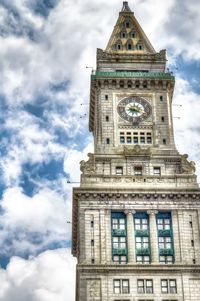 Low angle view of clock tower against sky