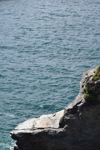 High angle view of rocks by sea