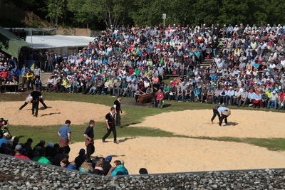 Crowd watching sport in stadium