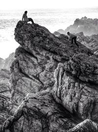 Scenic view of sea with rocks in background