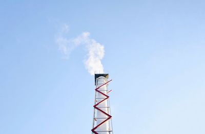 Low angle view of built structure against clear blue sky