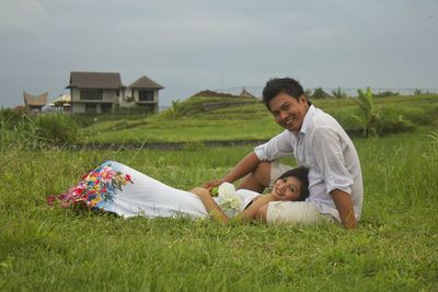 Couple kissing on field