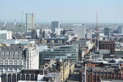 High angle view of buildings in city against sky