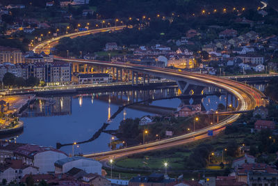 High angle view of illuminated bridge over river at night