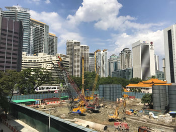Modern buildings in city against sky