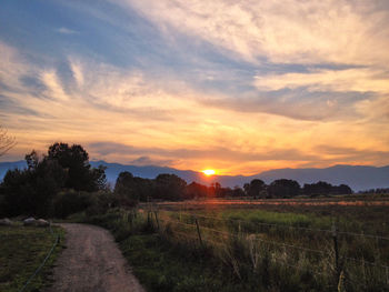 Scenic view of landscape at sunset