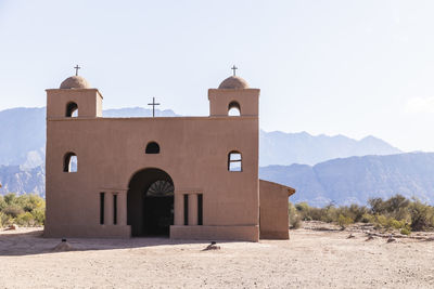 View of rustic church against sky