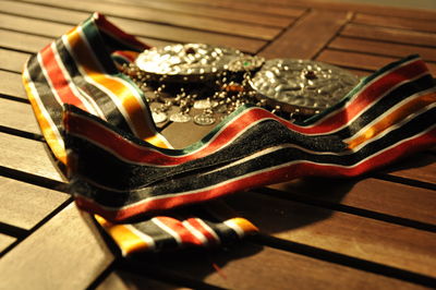 Close-up high angle view of medals on table