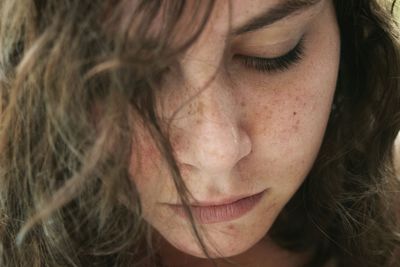 Close-up of thoughtful young woman looking down