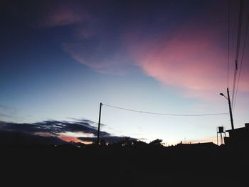 Silhouette landscape against sky during sunset