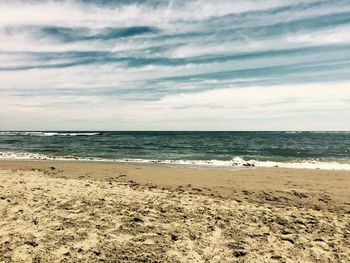 Scenic view of beach against sky
