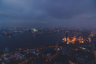 High angle view of illuminated buildings in city at night