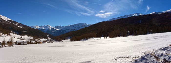 Scenic view of snowcapped mountains against sky