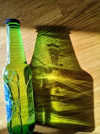 Green bottles on table