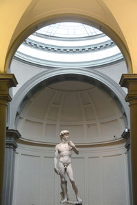 Low angle view of angel sculpture on ceiling