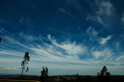 Scenic view of landscape against blue sky