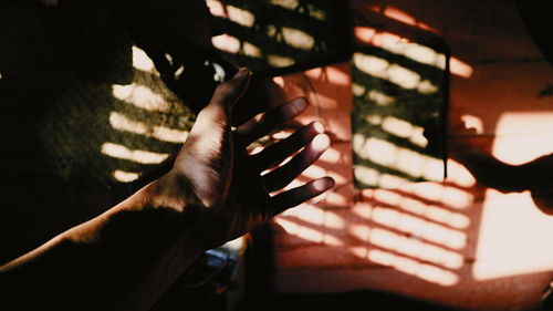 Close-up of hand in darkroom