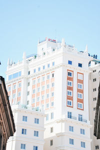 Low angle view of buildings against clear sky