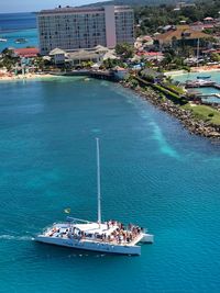 High angle view of people on yacht in sea