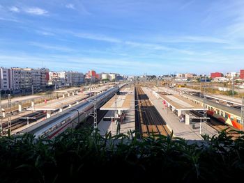 High angle view of train in city against sky