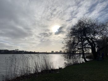 Scenic view of lake against sky during sunset